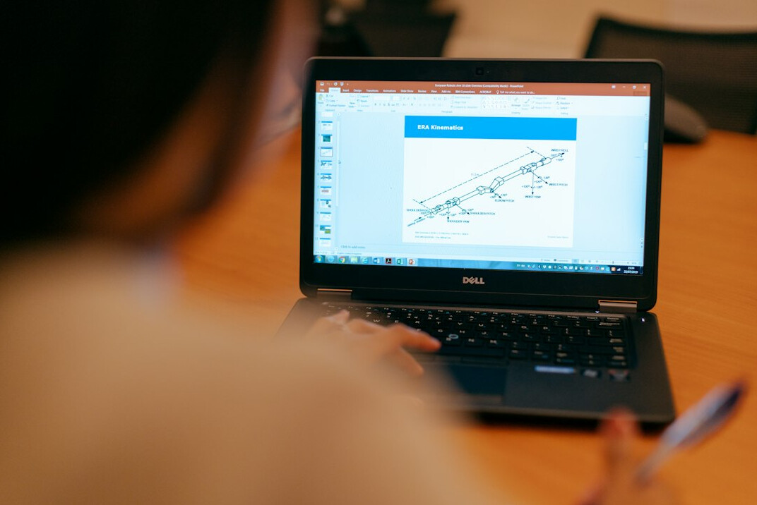 woman using online calculator on laptop