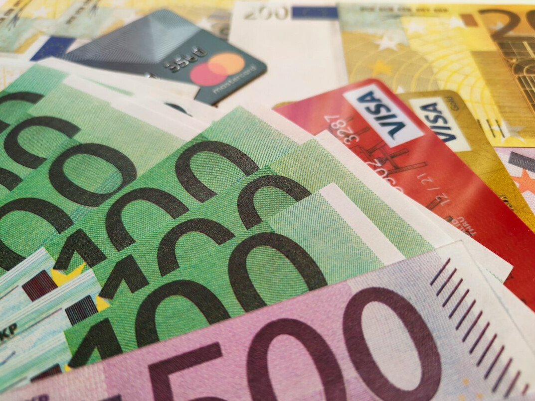 stack of euro bills and documents