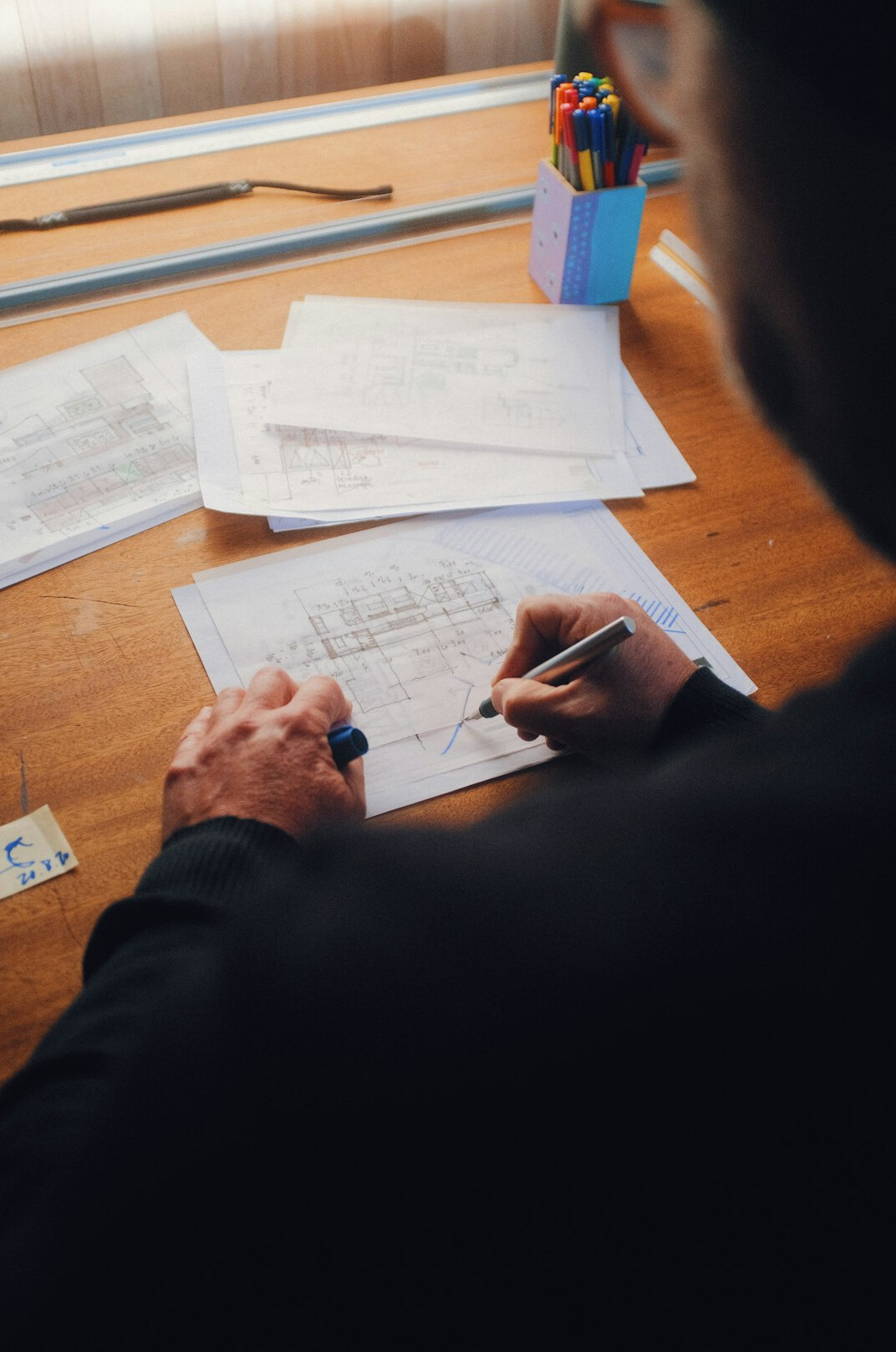 person reviewing loan documents at desk